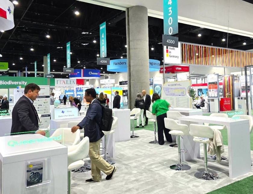 A group of people walking through the main show floor of the BIO 2024 convention