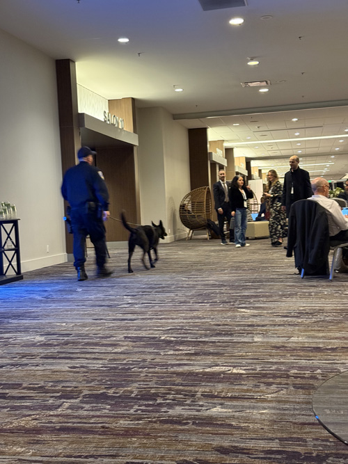 Security dog and handler walking the hallway at JP Morgan